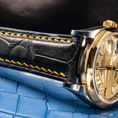 Black-alligator-leather-watch-strap-for-Rolex-Datejust-41mm-yellow-gold-stitching-detail.png