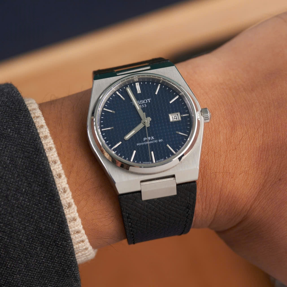 Black-epsom-calfskin-leather-strap-for-tissot-prx-on-hand.png