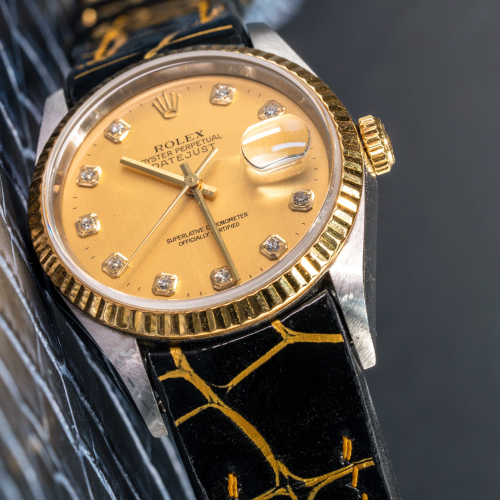 Black-gold-alligator-leather-watch-strap-for-Rolex-Datejust-36mm-on-watch.png