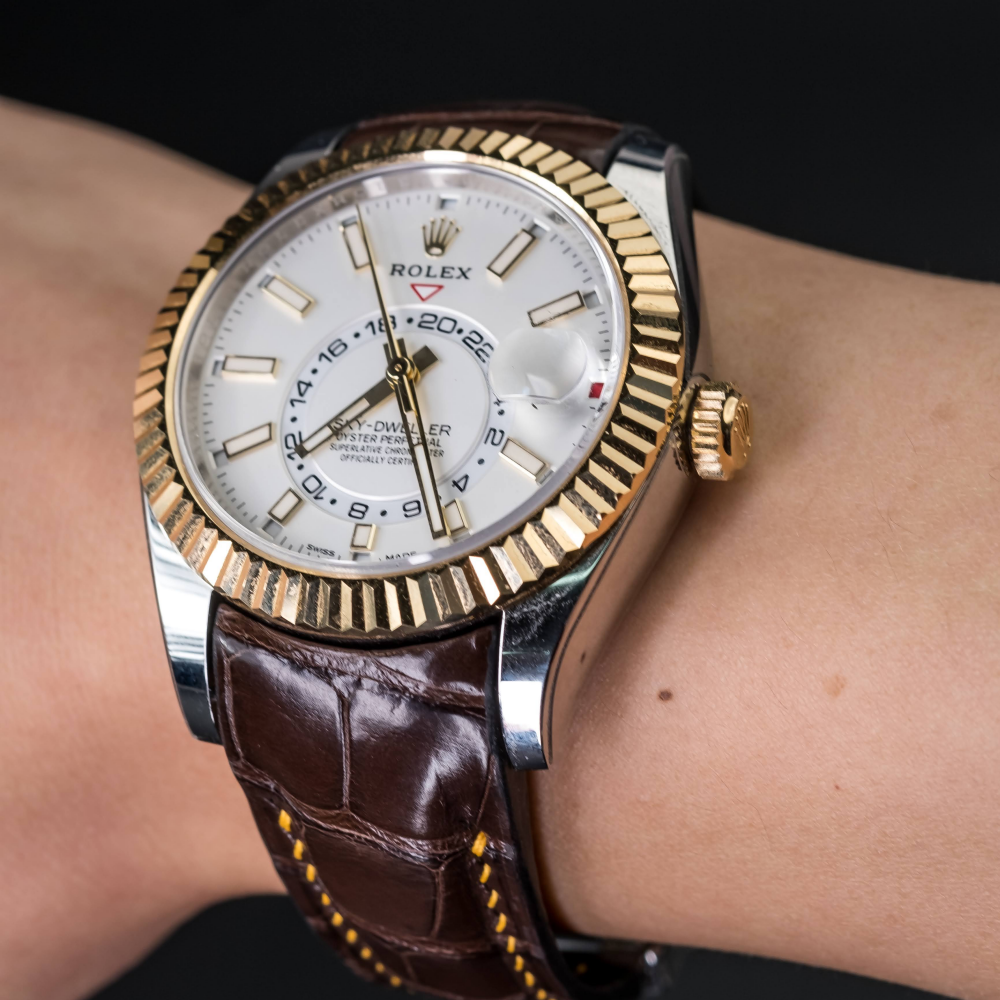 Brown-alligator-leather-watch-strap-for-Rolex-Sky-dweller-on-Hand.png