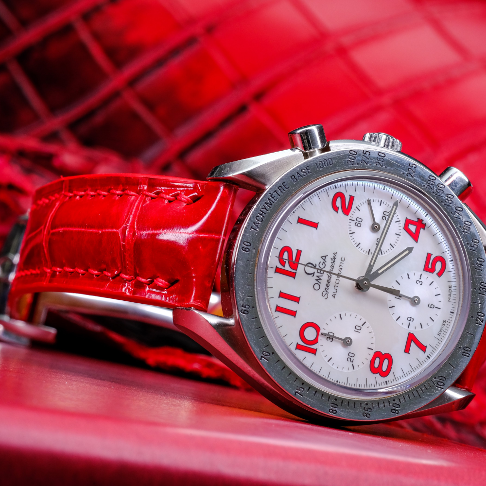 Ferrari-red-alligator-leather-watch-strap-for-Omega-Speedmaster-on-watch.png