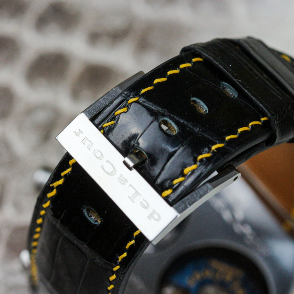 black-alligator-leather-strap-for-delacour-bichrono-with-yellow-stitching-buckle.png