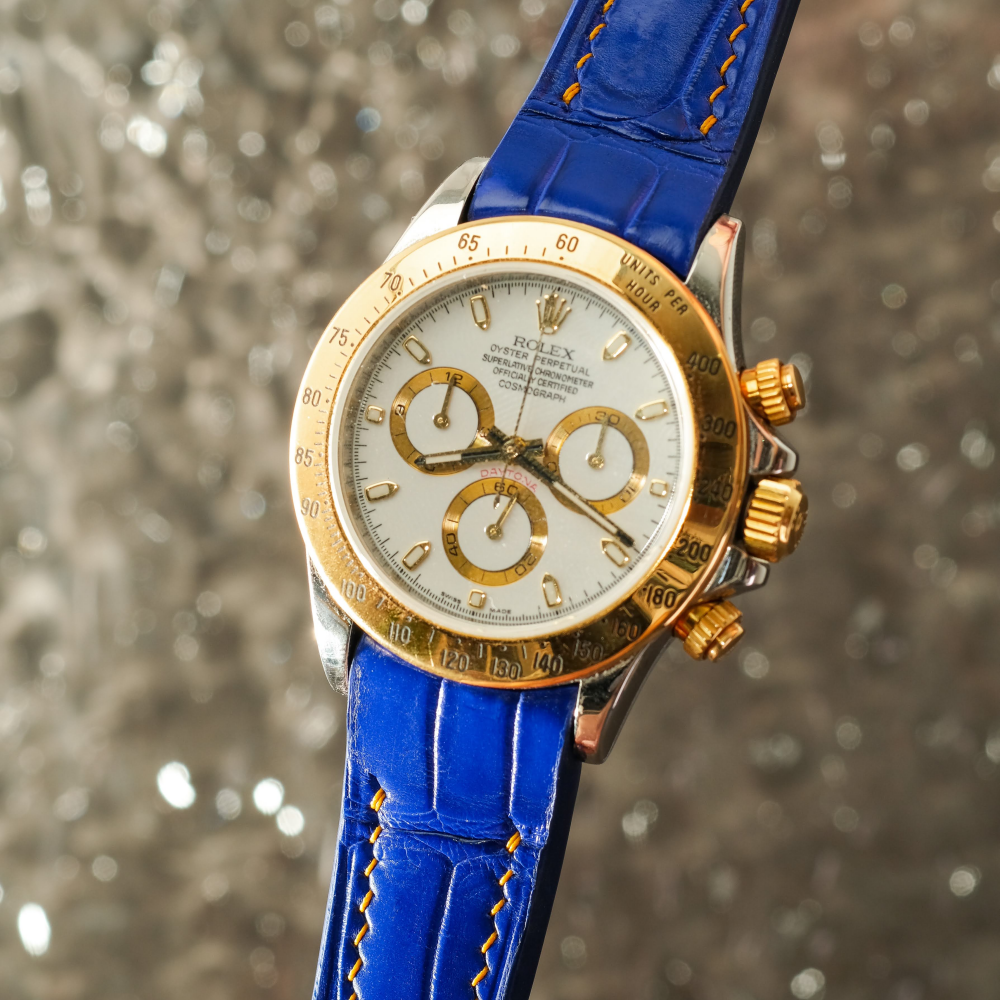 blue-alligator-strap-for-rolex-daytona-with-yellow-gold-stitching.png