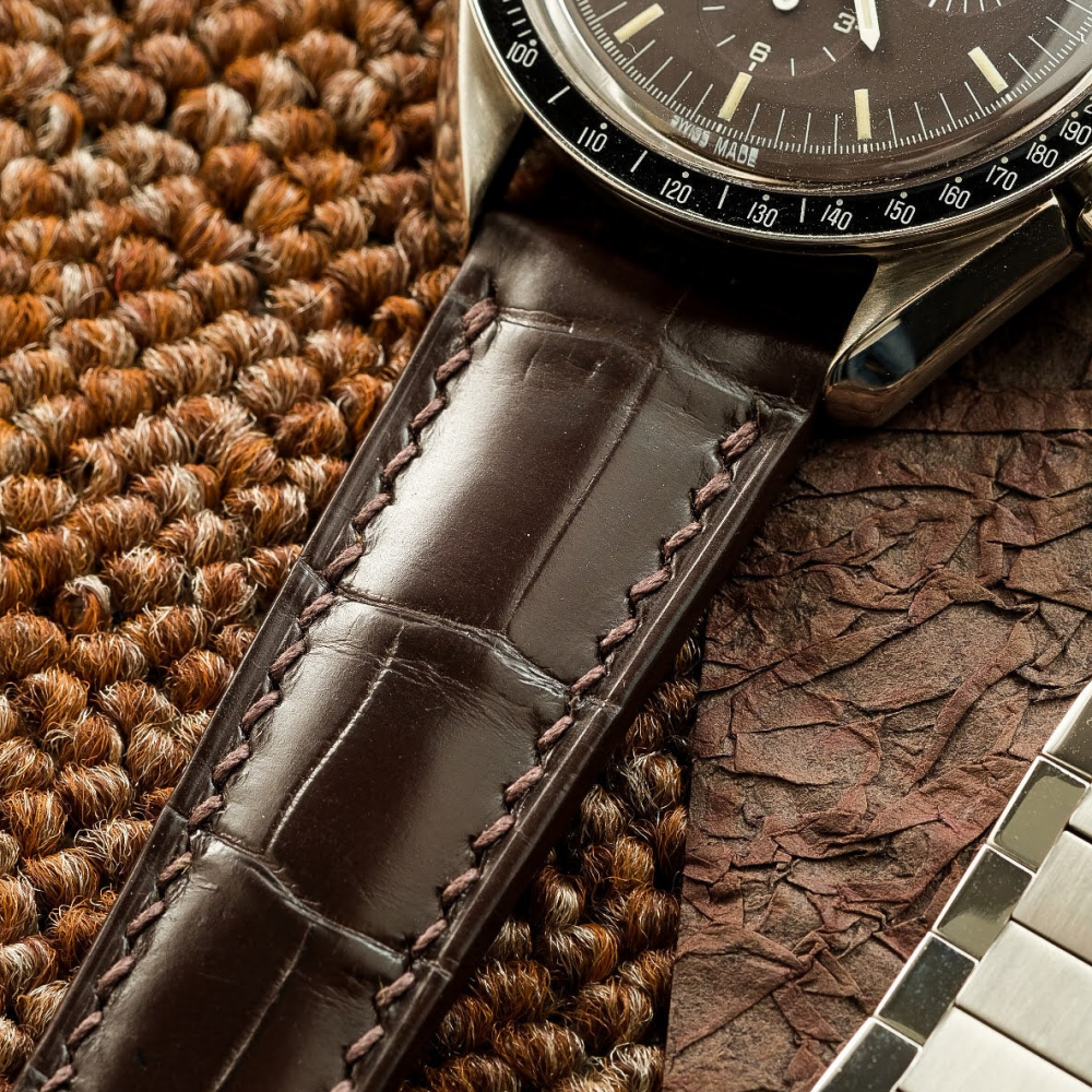 brown-alligator-leather-watch-strap-for-Omega-Speedmaster-on-watch.png