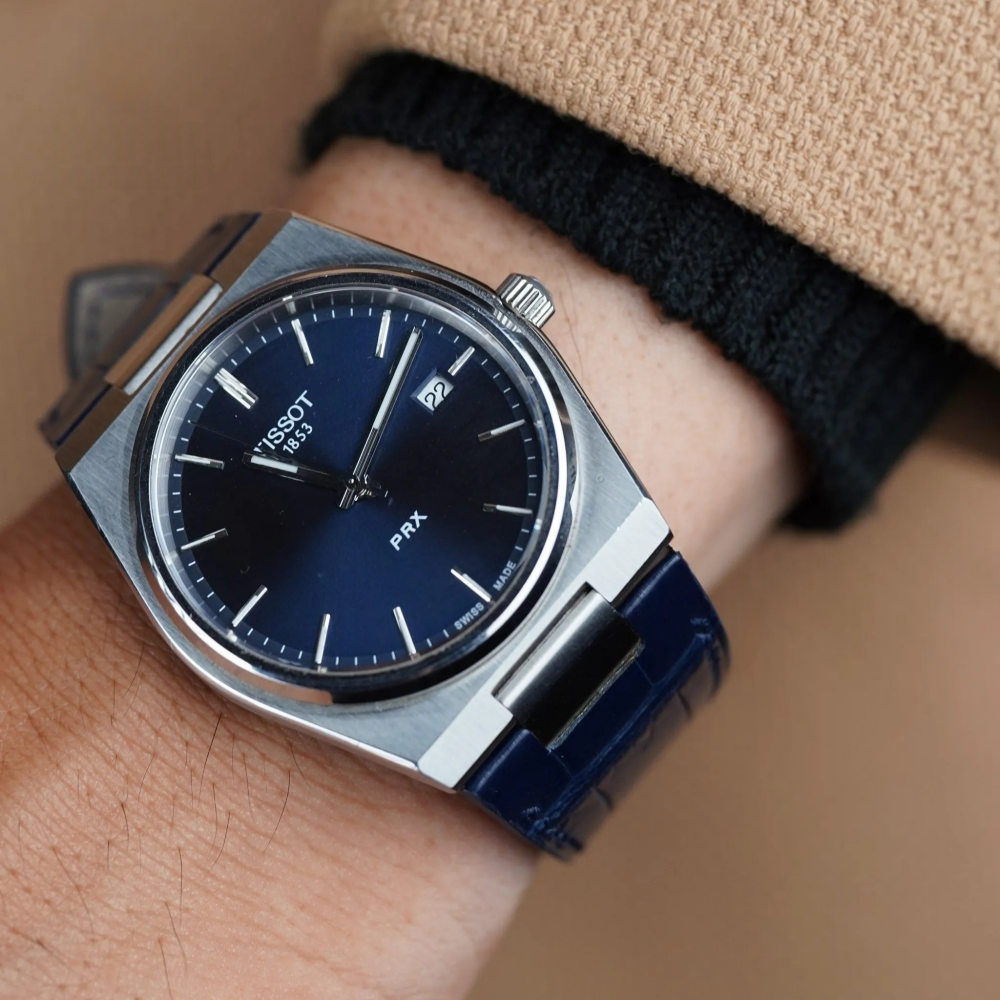 dark-navy-alligator-leather-watch-strap-for-tissot-prx-on-hand.png