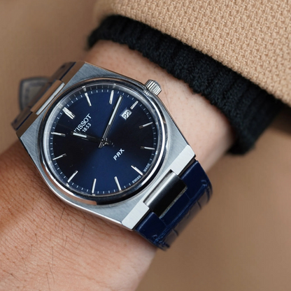 dark-navy-alligator-leather-watch-strap-for-tissot-prx-on-hand.png
