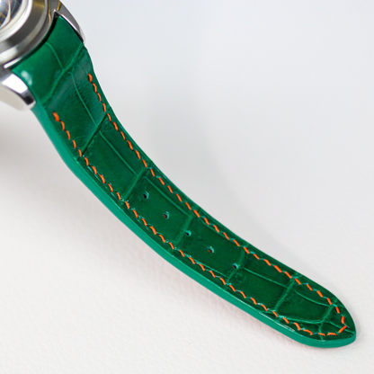 emerald-green-alligator-leather-strap-for-corum-bubble-orange-stitching.png