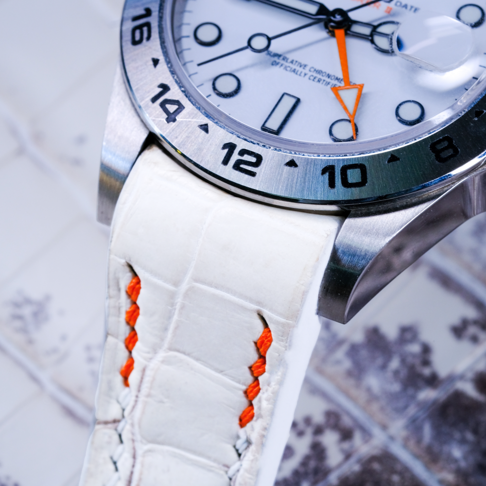 himalayan-alligator-leather-strap-for-rolex-explorer-ii-orange-white-stitching-detail.png