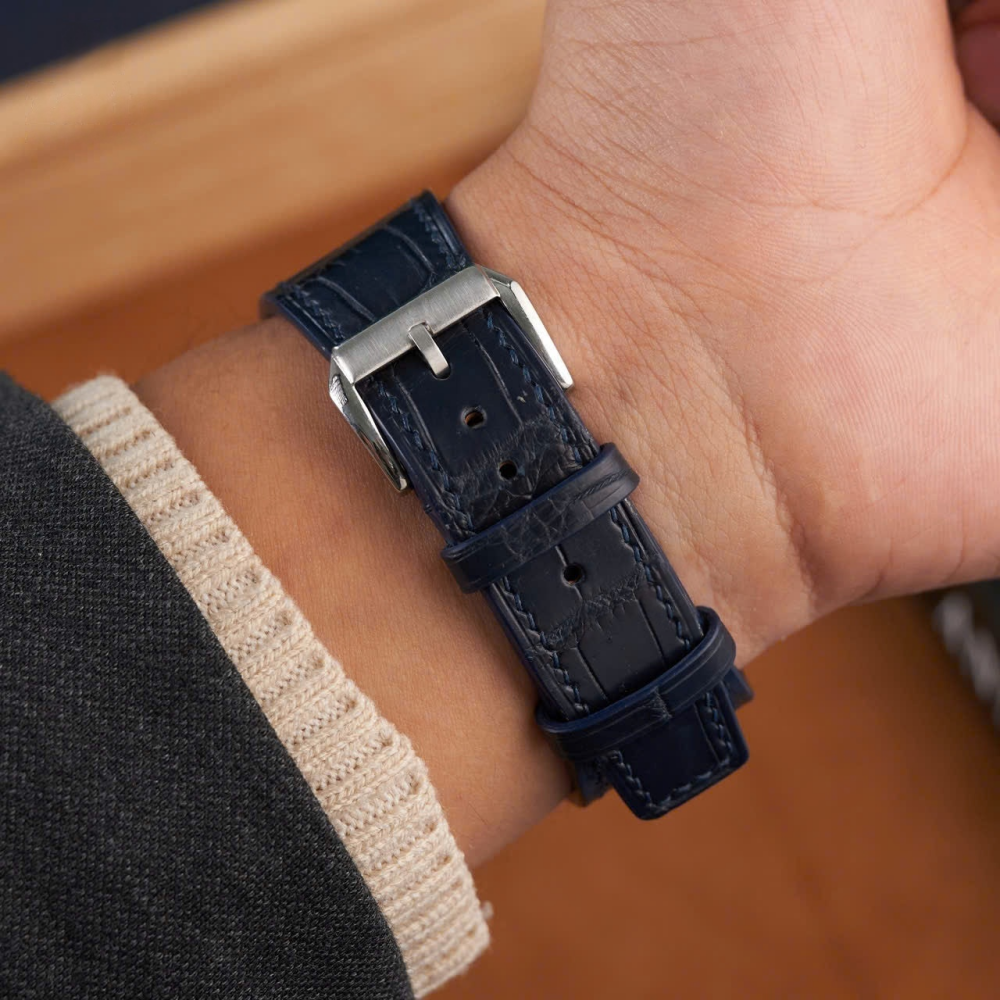 matte-navy-alligator-leather-watch-strap-for-tissot-prx-on-hand-detail.png