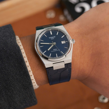 matte-navy-alligator-leather-watch-strap-for-tissot-prx-on-hand.png