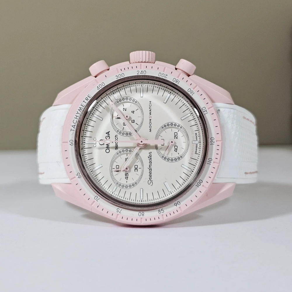 white-rubber-strap-for-omega-x-swatch-moonswatch-mission-to-Venus-with-pink-line-on-watch.png